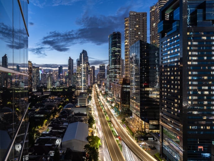 A busy business district in Jakarta, Indonesia at twilight.