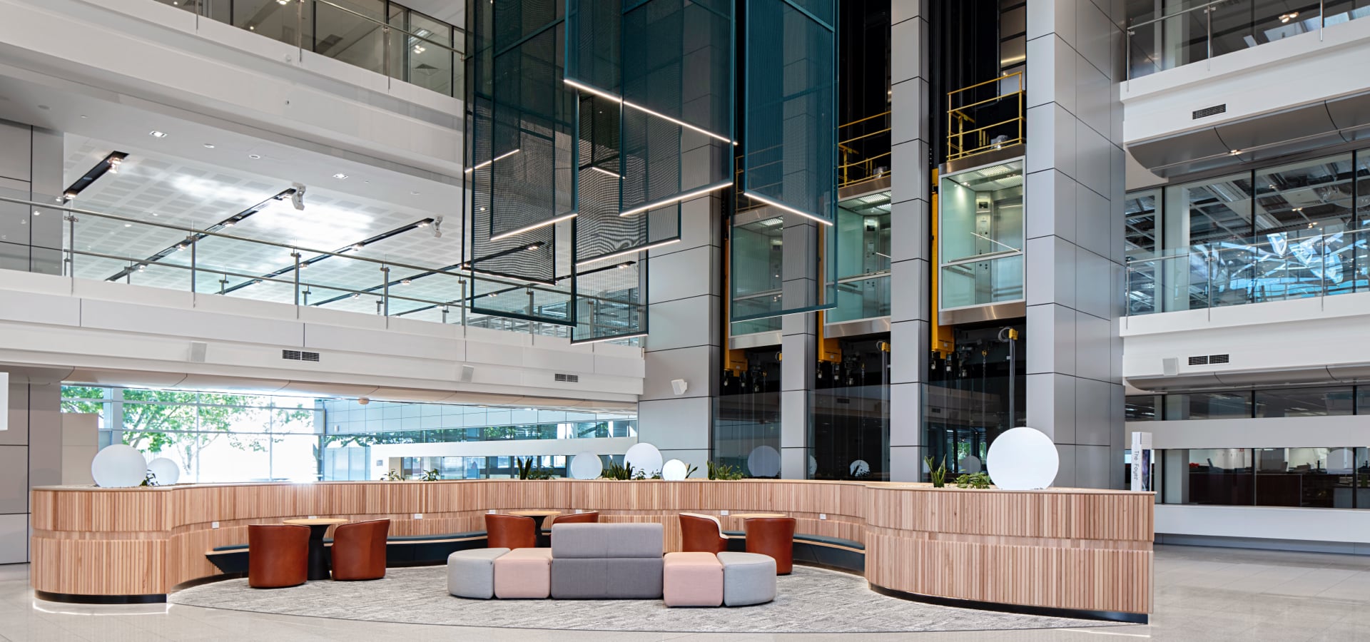 A lobby with a reception desk and chairs.